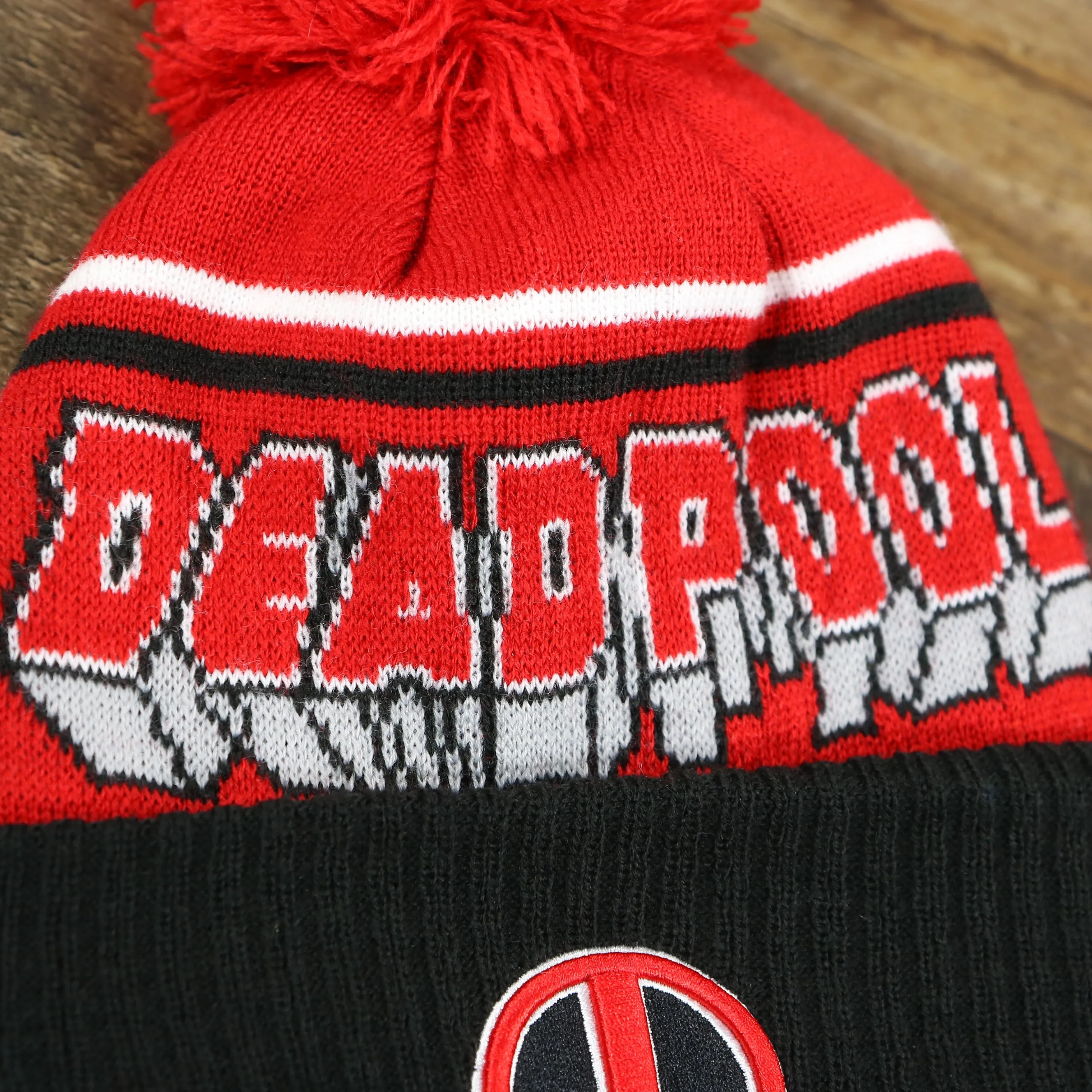 DC Comics Deadpool Mask Logo Deadpool Wordmark Striped Beanie With Red Pom Pom | Red And Black Winter Beanie