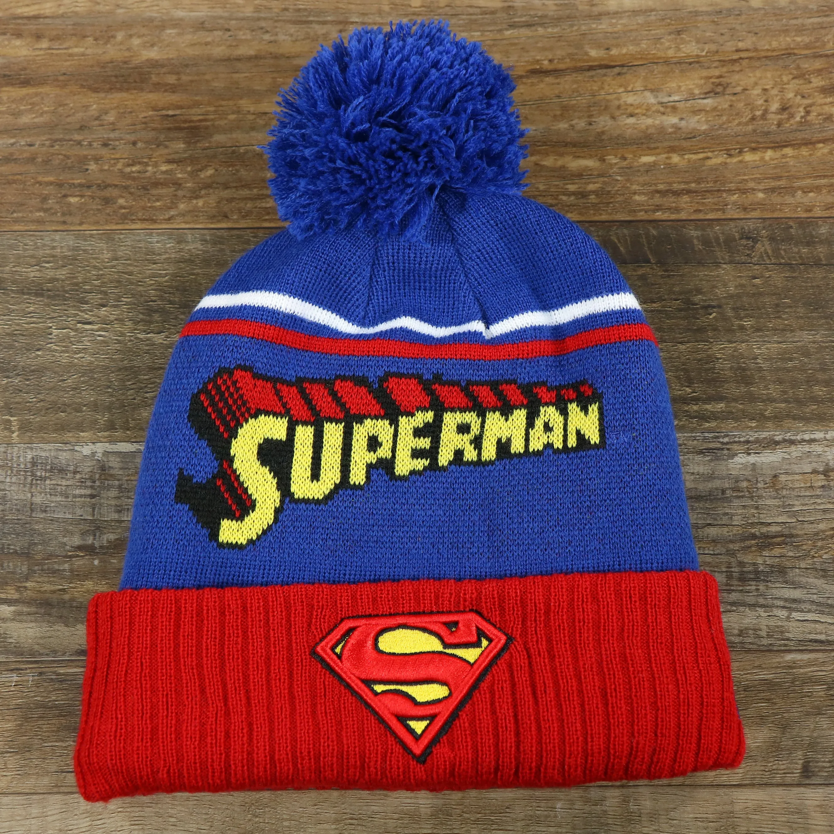 DC Comics Superman S-Shield Logo Superman Wordmark Striped Beanie With Blue Pom Pom | Blue And Red Winter Beanie