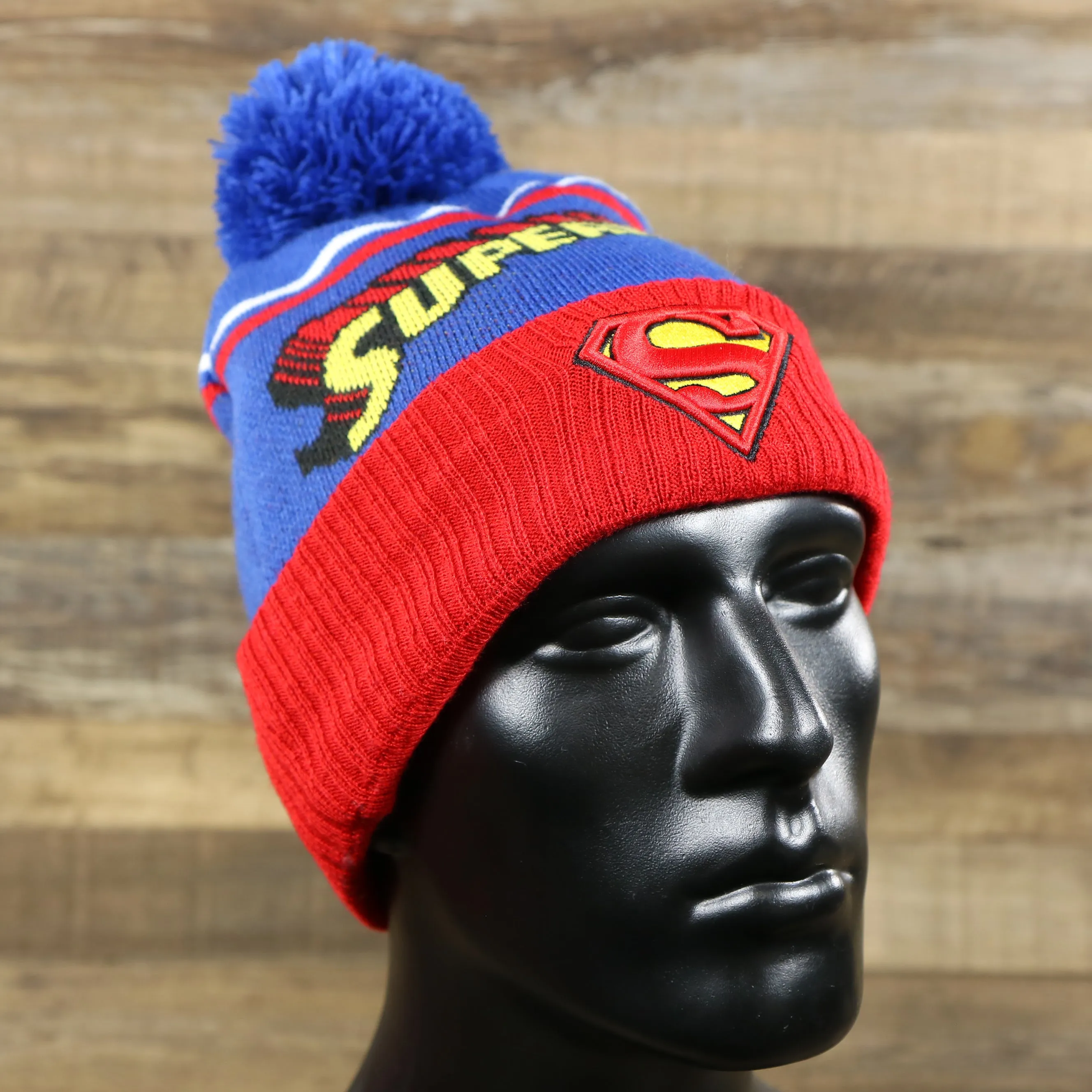 DC Comics Superman S-Shield Logo Superman Wordmark Striped Beanie With Blue Pom Pom | Blue And Red Winter Beanie