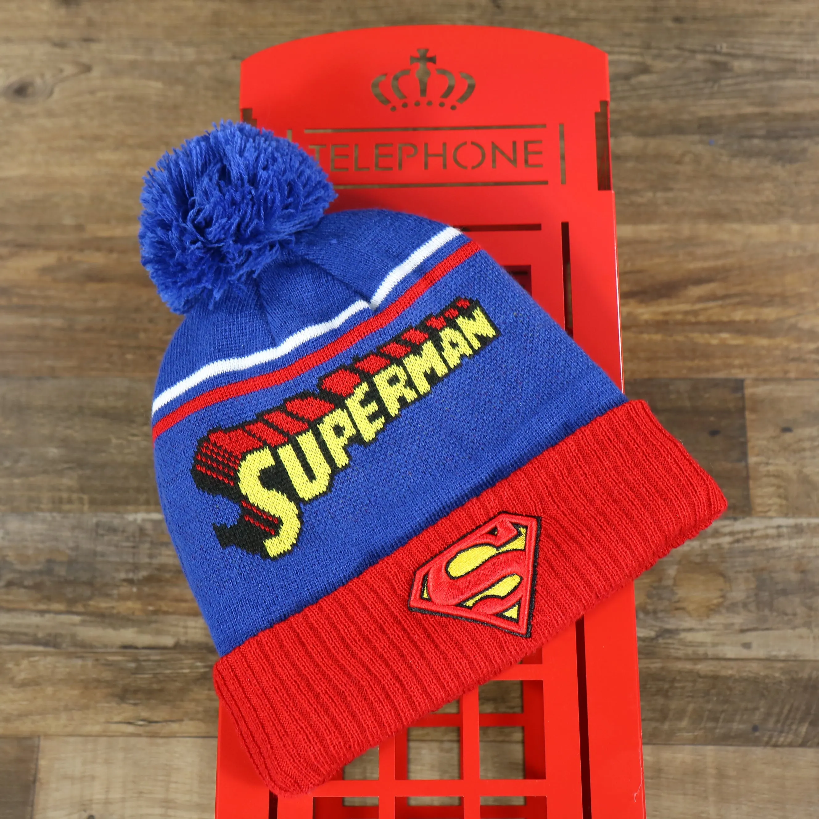 DC Comics Superman S-Shield Logo Superman Wordmark Striped Beanie With Blue Pom Pom | Blue And Red Winter Beanie