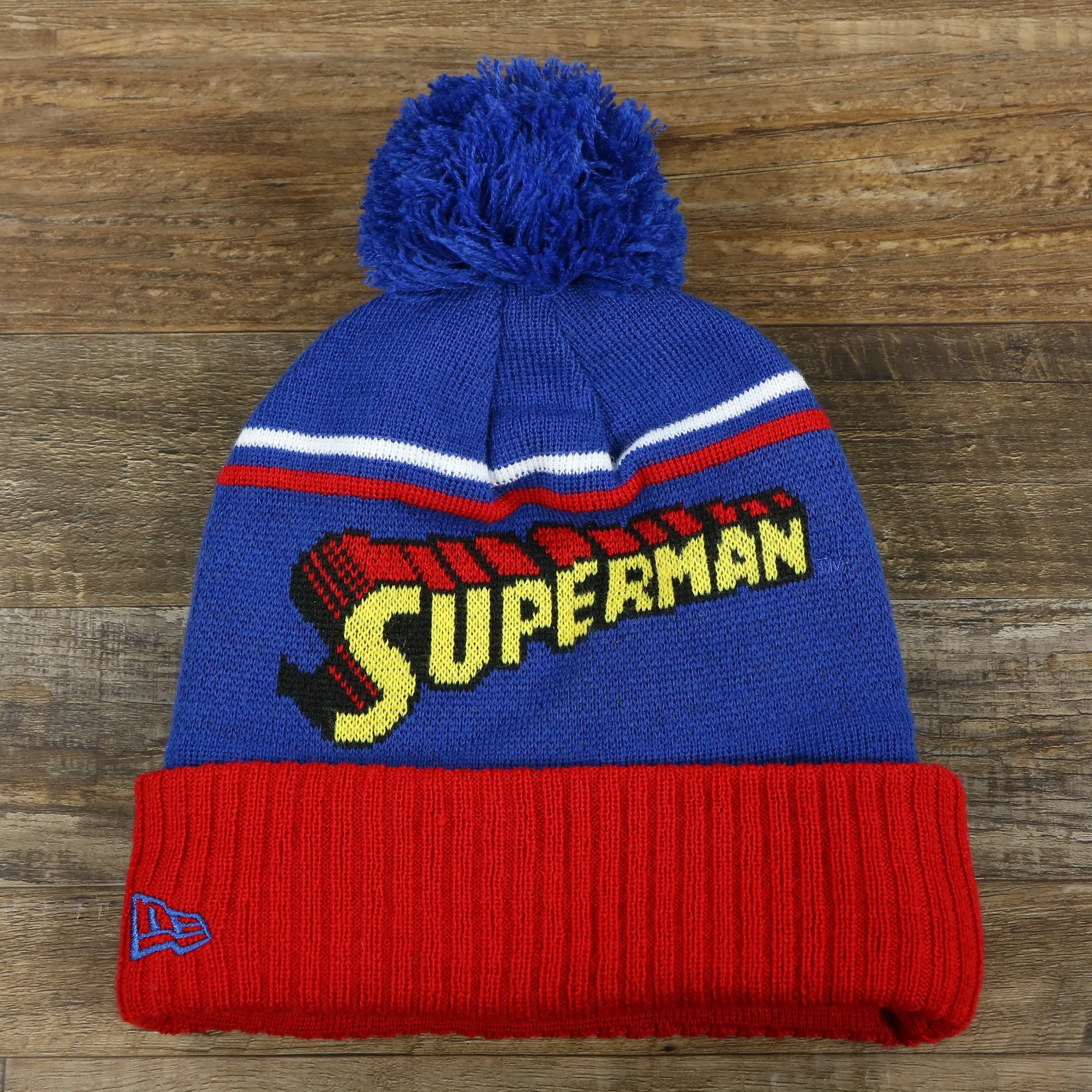 DC Comics Superman S-Shield Logo Superman Wordmark Striped Beanie With Blue Pom Pom | Blue And Red Winter Beanie