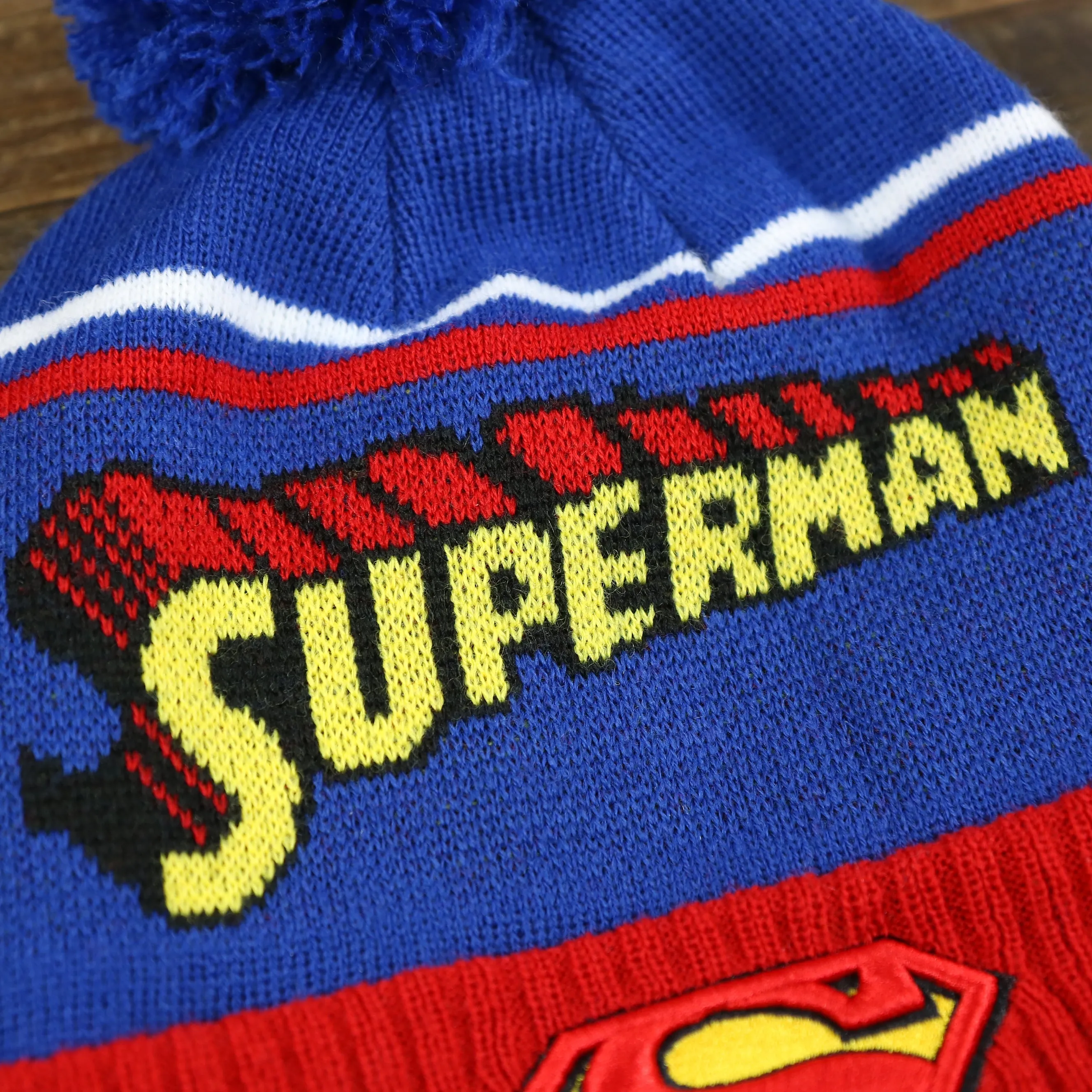 DC Comics Superman S-Shield Logo Superman Wordmark Striped Beanie With Blue Pom Pom | Blue And Red Winter Beanie