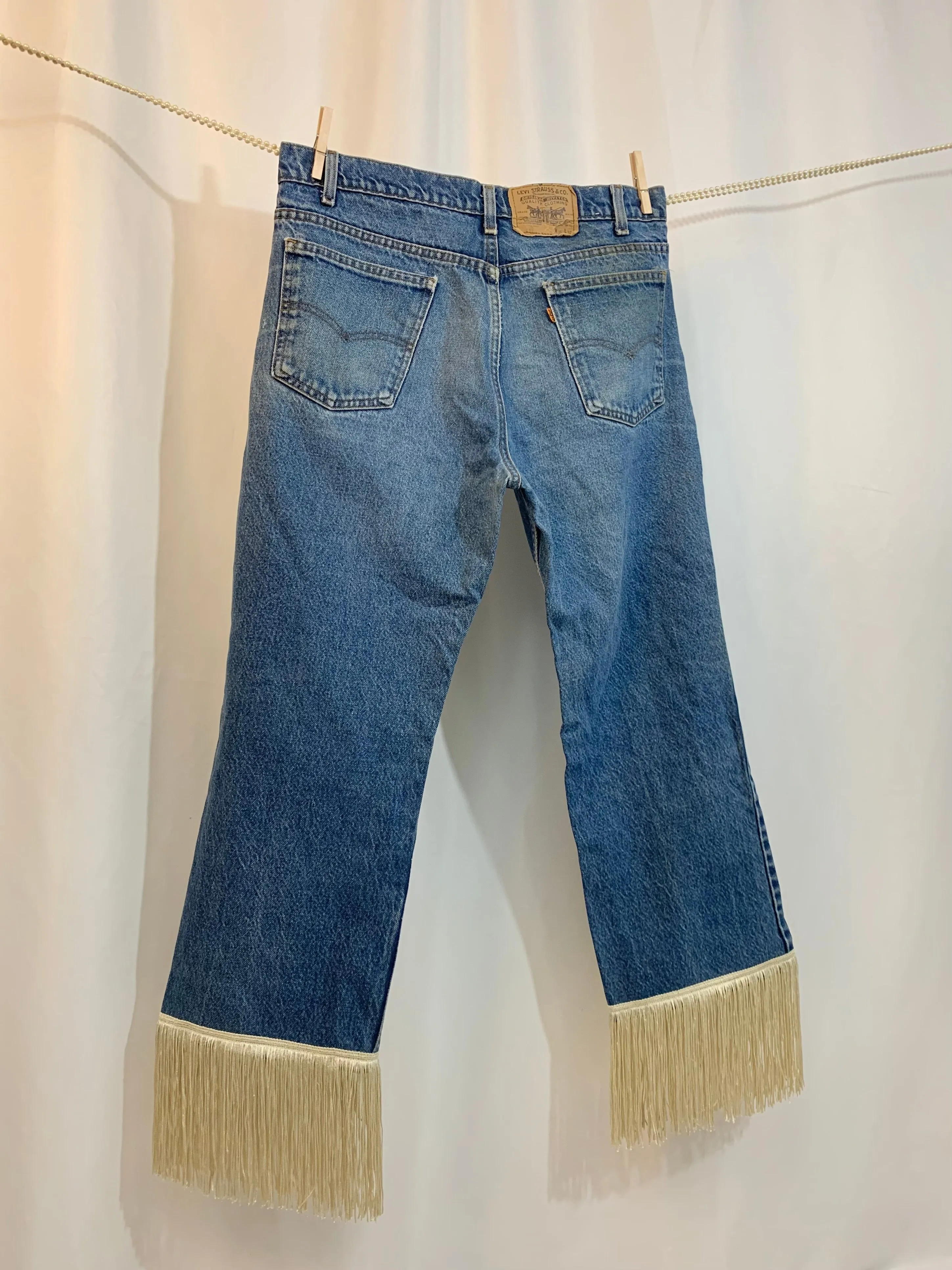 Upcycled 517 fringe jeans